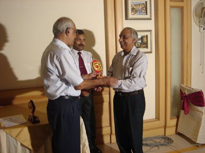 Mr. H.L. Atri receiving Guest of Honor Memento from Dr. Gorantla Lakshmi Naryana (Topper of the Batch) in Farewell Party.